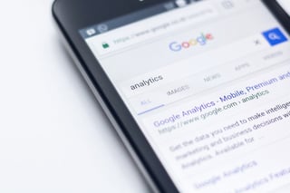 iPhone with a Google SERP displaying Google Analytics 